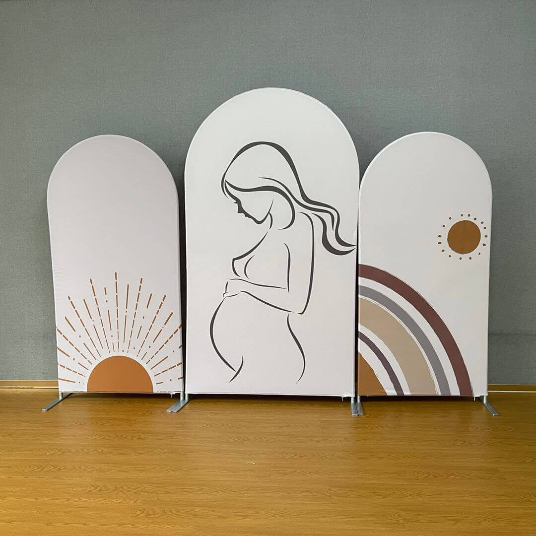Three-panel boho-themed arched backdrop set featuring a pregnant woman silhouette, a warm rainbow design, and a sunburst illustration in earthy tones, perfect for baby showers and gender reveal parties.