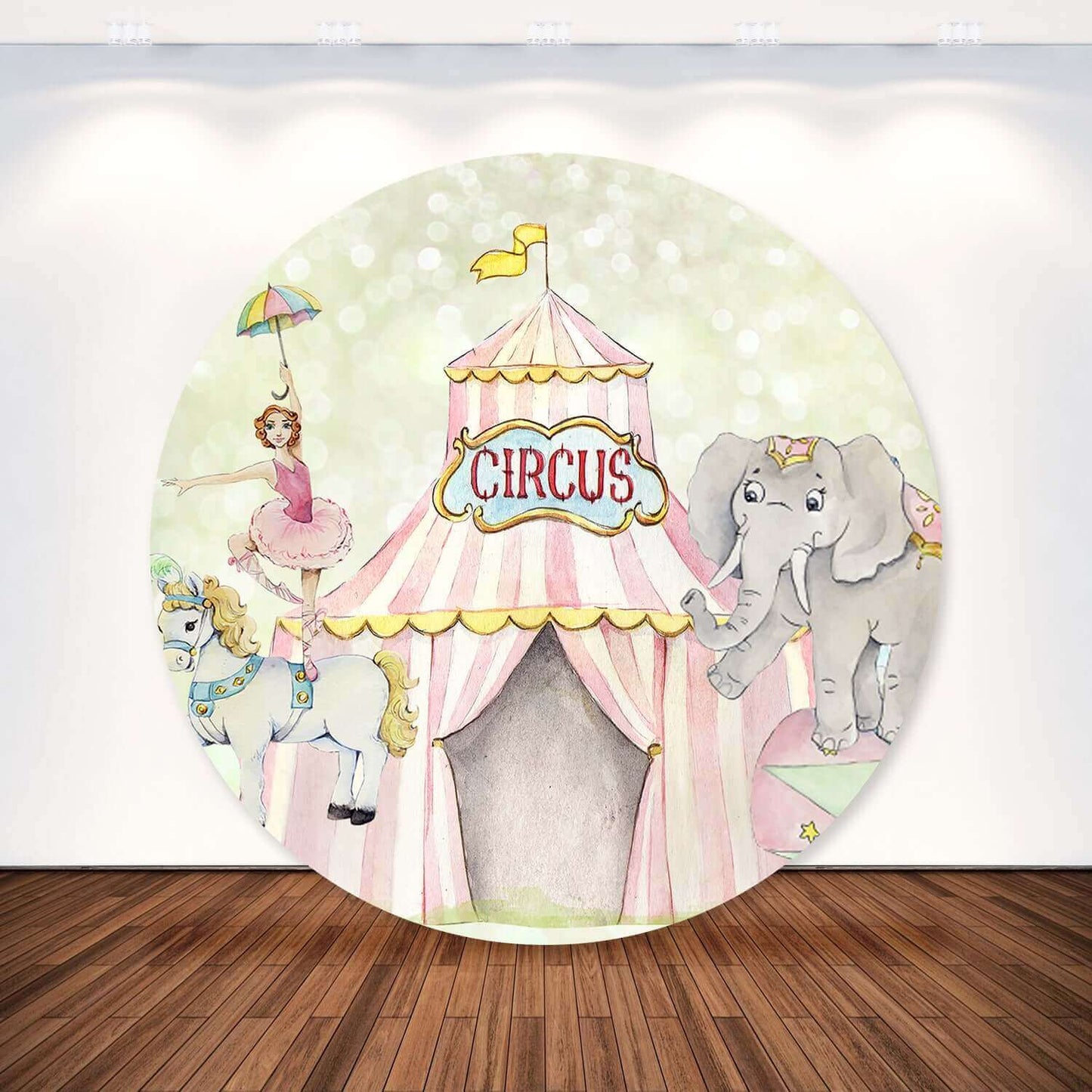 Pink circus-themed round backdrop with a ballerina on a carousel horse, an elephant balancing, and a circus tent with pastel colors for kids' parties or events.