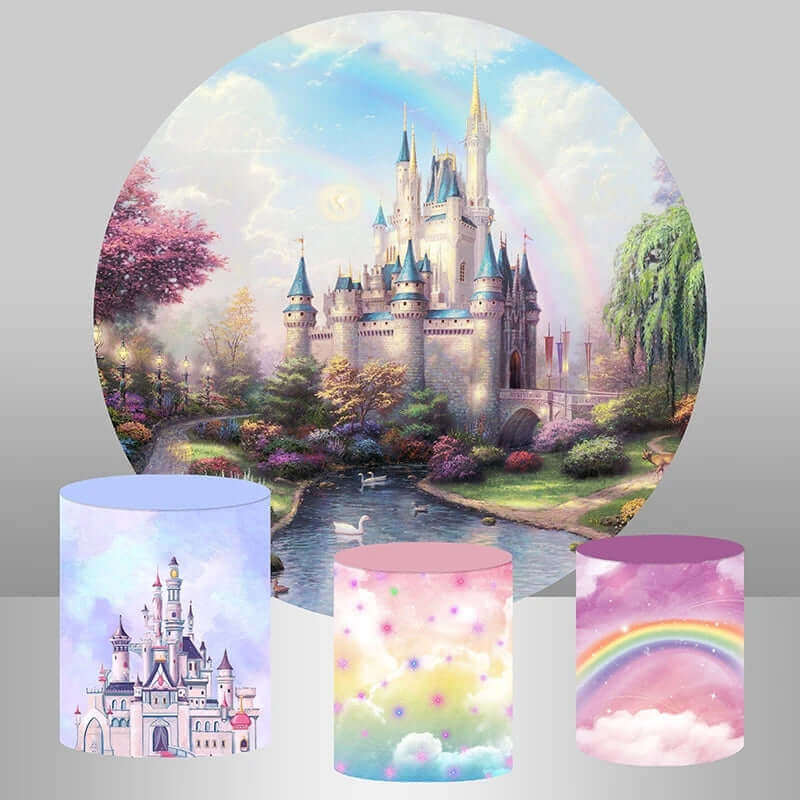 Fairy-themed round party backdrop featuring a majestic castle surrounded by gardens, a stream, and a rainbow, with three matching colorful cylinder covers.