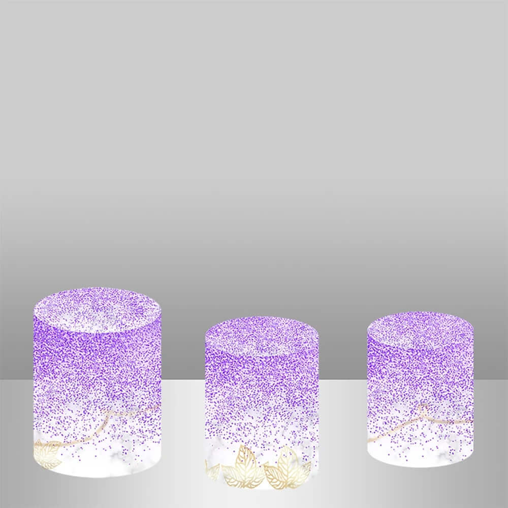 A set of three decorative cylinder covers with matching purple glitter, marble patterns, and gold leaf accents, ideal for elegant party setups.