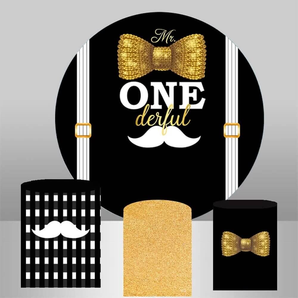 Mr. One-derful birthday backdrop and cylinder covers set featuring a black backdrop with a golden bow tie and mustache graphic, complemented by three matching cylinder covers: black-and-white striped, glitter gold, and black with a gold bow tie.