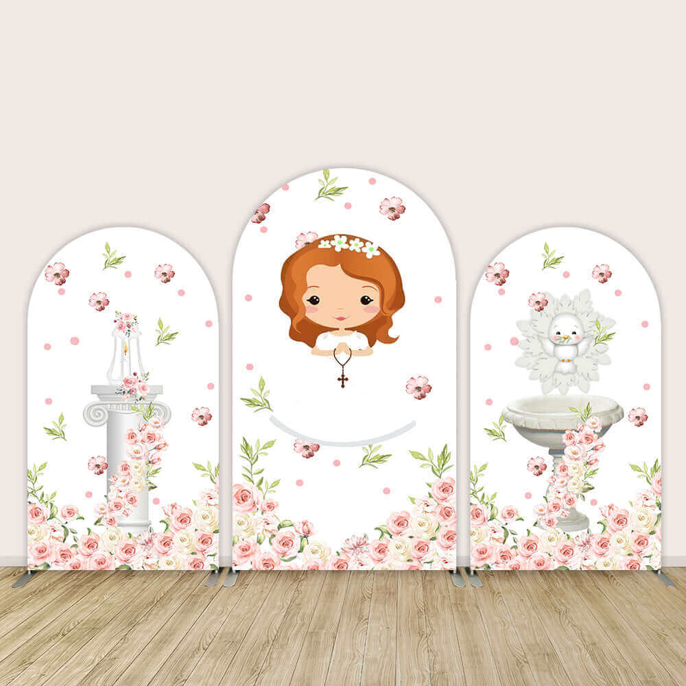 Set of three arch backdrop covers with pink flowers, a cartoon girl holding a rosary, a candle on a column, and a baptismal font for religious celebrations like baptisms or first communions.