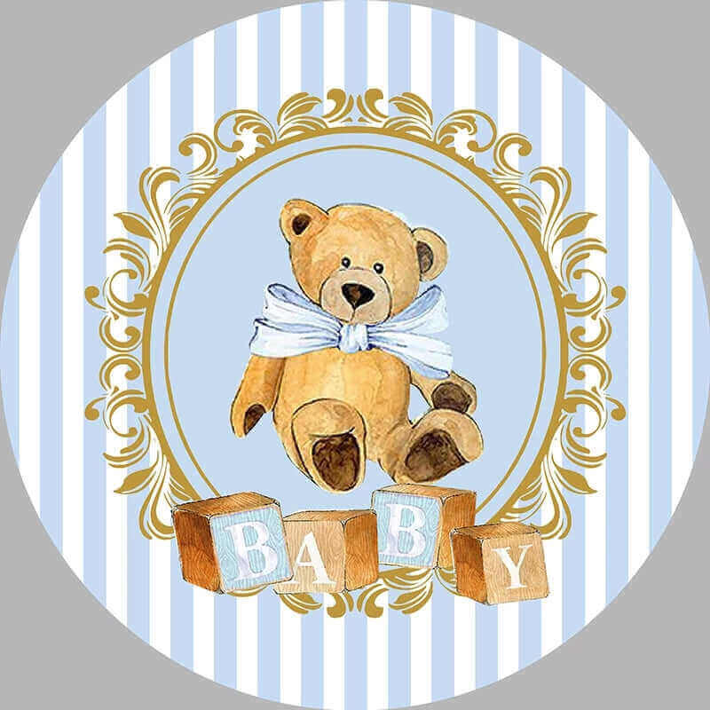 White and blue striped backdrop with a teddy bear sitting on the ground with wooden 'BABY' blocks, perfect for a baby shower or boy's celebration.