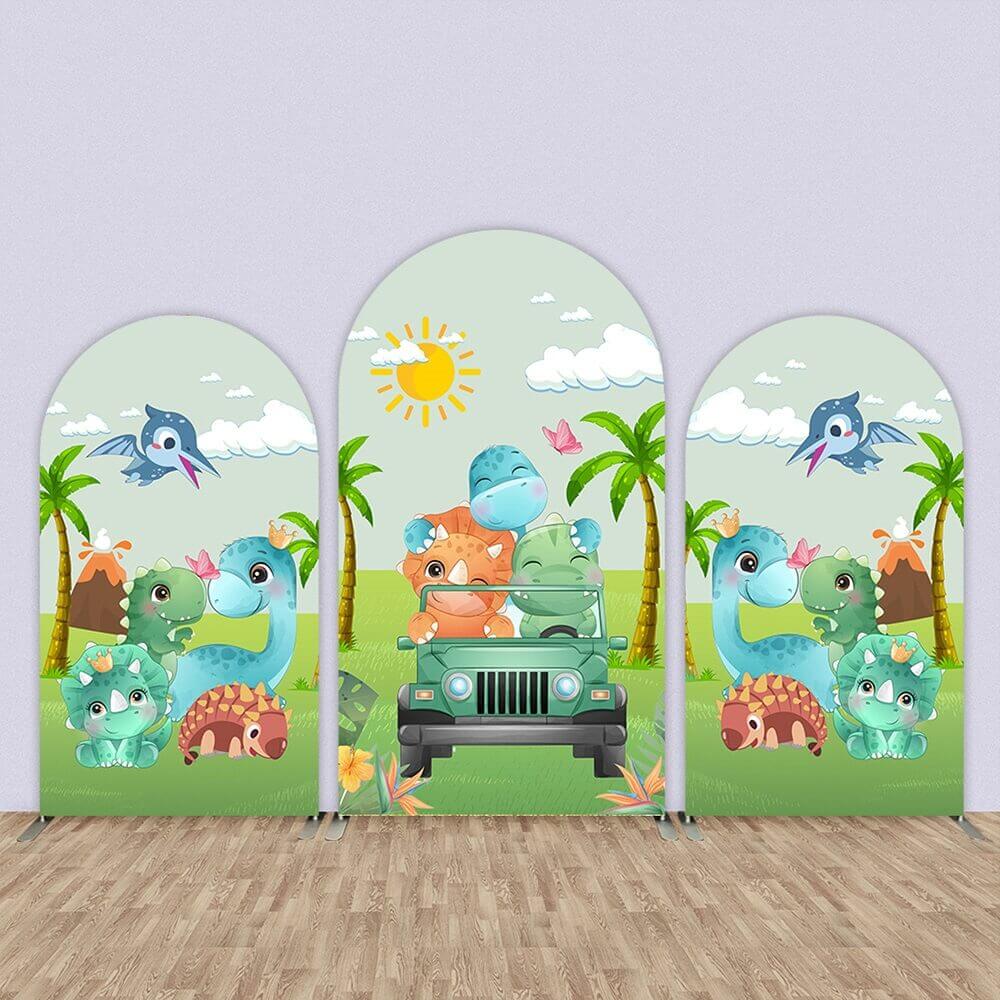 Set of three dinosaur-themed arched backdrops featuring cartoon dinosaurs, a safari jeep, palm trees, and volcanoes in a jungle setting for kids’ birthday parties.