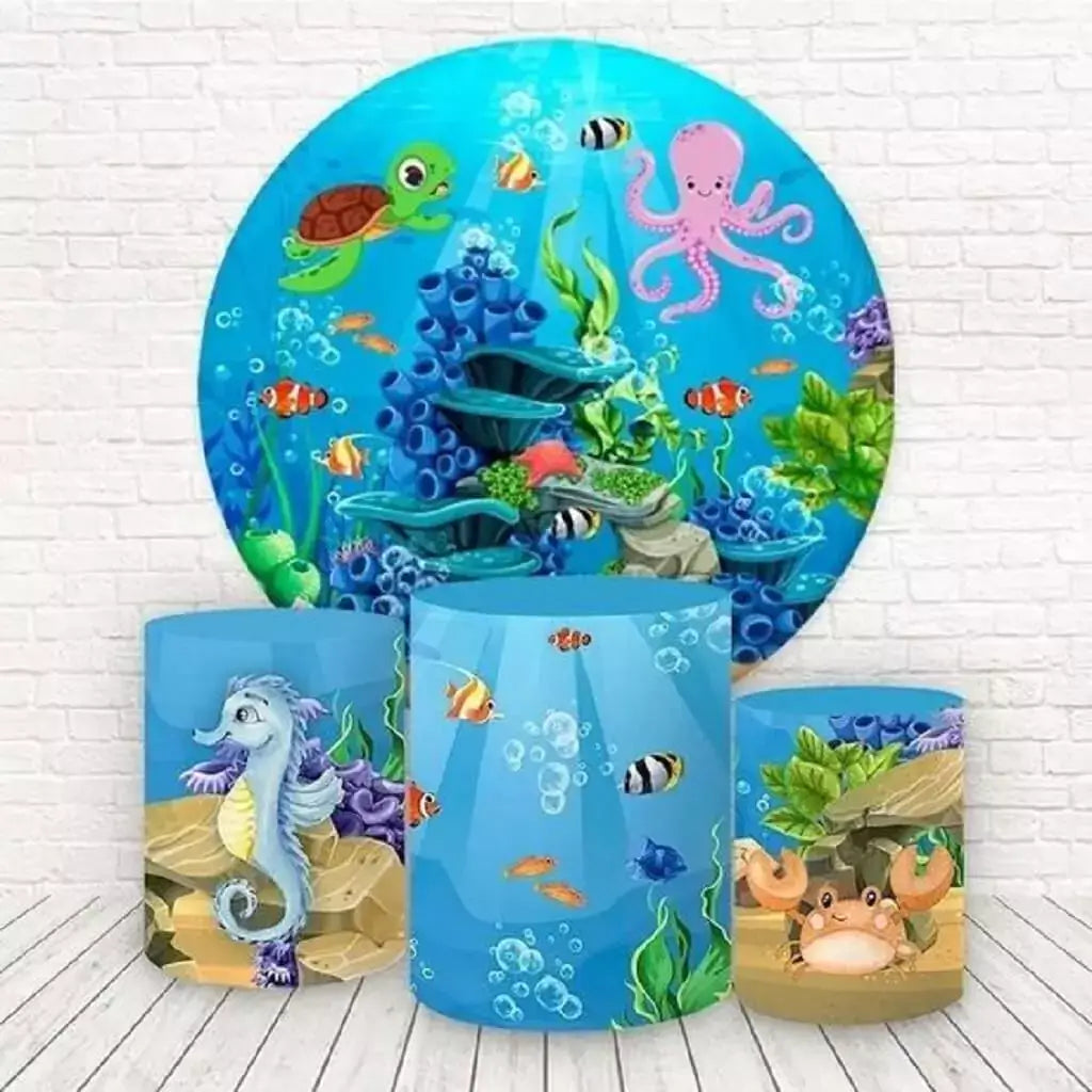 A round ocean-themed backdrop featuring coral reefs, a pink octopus, a sea turtle, and tropical fish, paired with cylinder covers showcasing a seahorse, bubbles, and a crab.