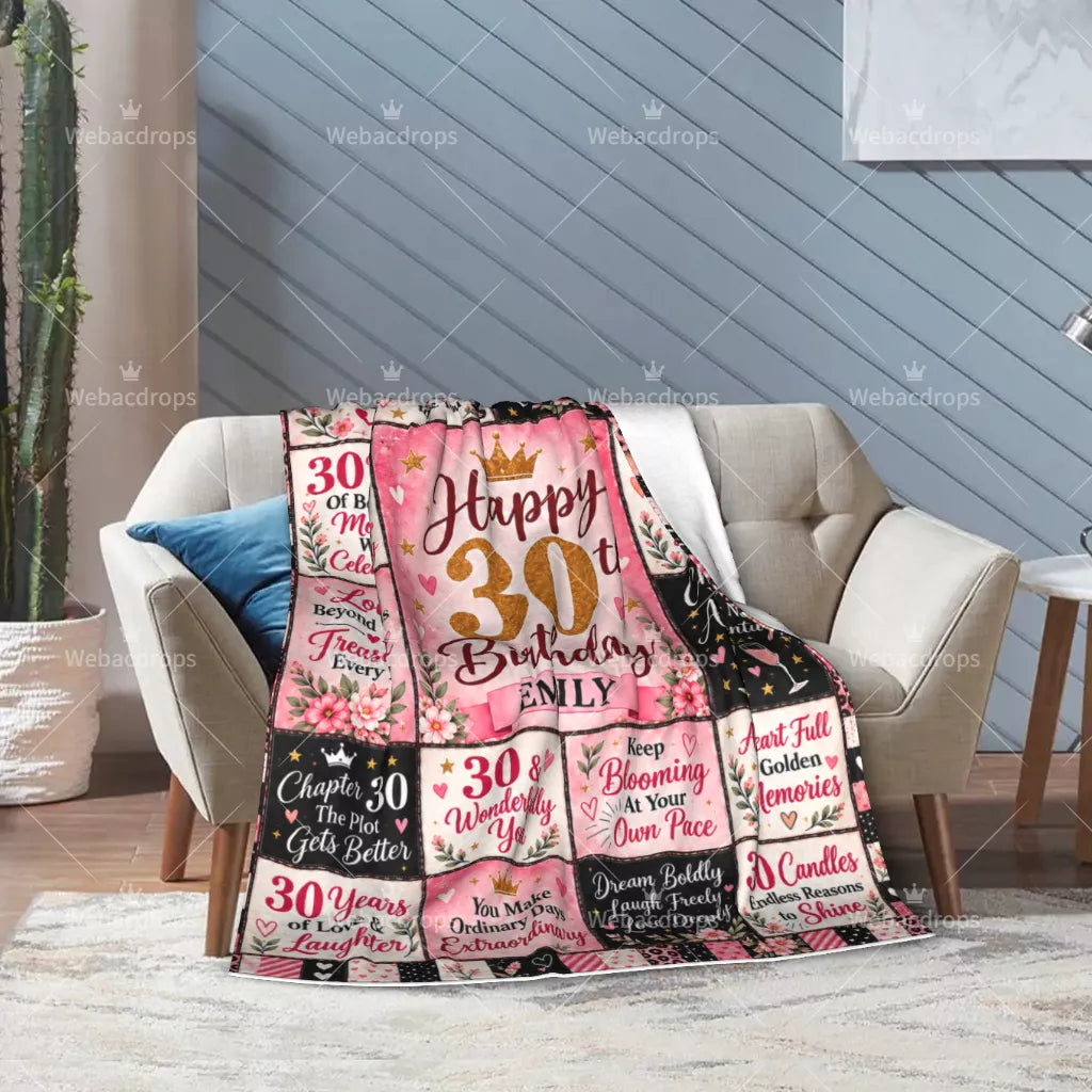 Pink personalized 30th birthday blanket displayed on an armchair, a sentimental birthday gift for women
