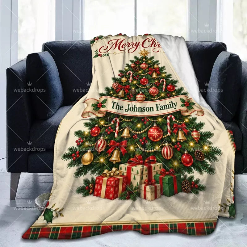 Custom family Christmas blanket draped over an armchair, featuring a decorated Christmas tree and personalized family name.