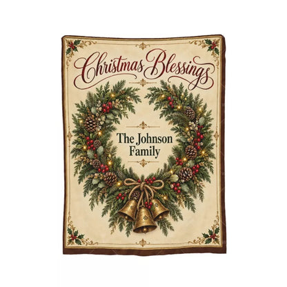Full view of a personalized Christmas Blessings blanket with an open evergreen wreath, three vintage golden bells, and The Johnson Family name.