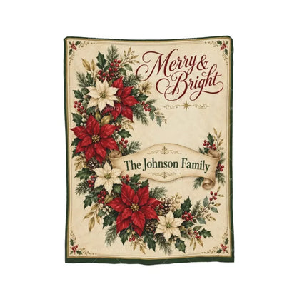 Full view of a personalized poinsettia Christmas blanket with Merry & Bright lettering, vintage floral arrangement, and The Johnson Family on a cream scroll.