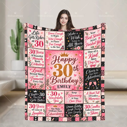 Woman holding a personalized 30th birthday blanket with floral quotes, gold number 30 and custom name Emily