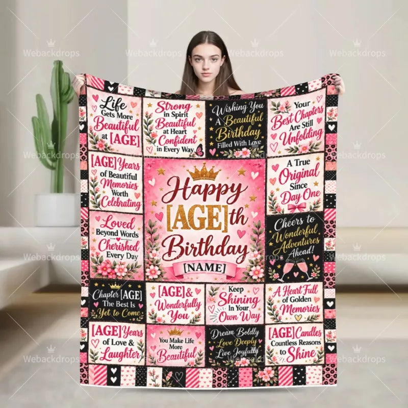 Woman holding a personalized birthday blanket with floral quotes, gold number and custom name
