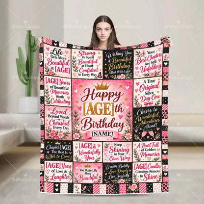Woman holding a personalized birthday blanket with floral quotes, gold number and custom name